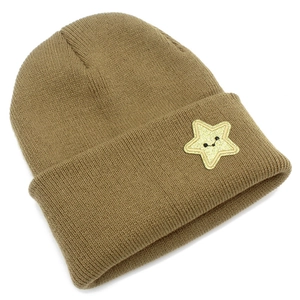 Detail of khaki ribbed knit beanie featuring a shimmering gold star patch with a smiley face