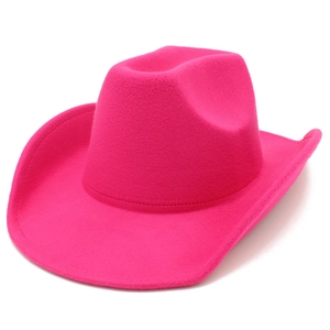 Detail view of the hot pink felt texture and curved brim of this western cowboy hat