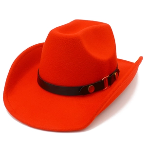 Detail of orange wool felt cowboy hat with black decorative band and gold metal hardware