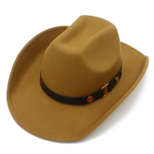 Detail of camel wool felt cowboy hat with black leather band and golden buckle