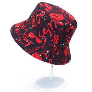 Detail of black cotton bucket hat with red lips and love heart graffiti print