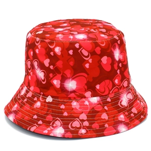 Close-up of red heart pattern on shiny fabric bucket hat with detailed brim stitching