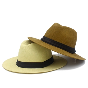Beige and tan Panama straw hats with black ribbon for sun protection and outdoor styling