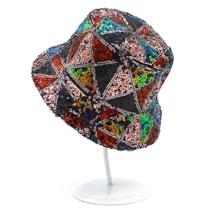 Detail of colorful sequins bucket hat with geometric triangle stitching on white background