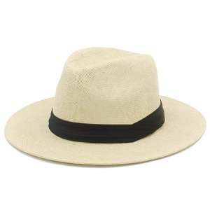 Close-up of the breathable light beige woven texture and black ribbon of the Panama hat