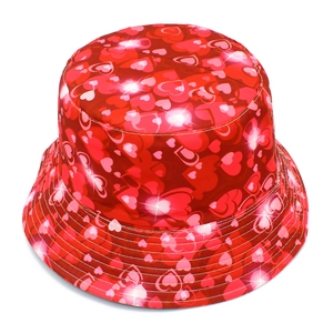 Detailed view of the red bucket hat featuring a trendy all-over heart print and star accents