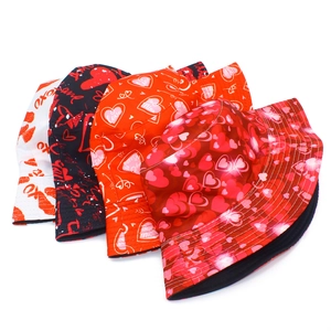 Detail view of four Valentine's themed bucket hats with heart and kiss prints