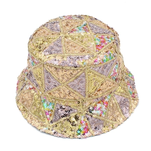 Macro shot of colorful sequins and triangular geometric stitching on a gold bucket hat