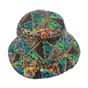 Macro detail of colorful geometric sequin patterns and gold lining on the bucket hat