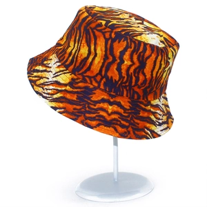 Detail view of bold orange and black tiger print pattern on a durable cotton bucket hat