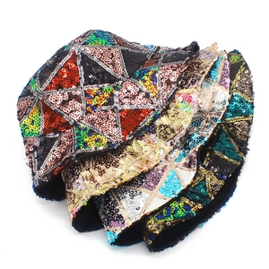 Close-up of colorful sequins and geometric triangle patterns on a punk style bucket hat