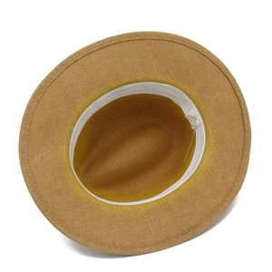 Close-up of Panama hat interior showing 100% paper material label and sweatband