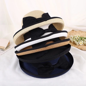 Elegant women's straw sun hats with ribbon bows in beige, white, black and navy colors