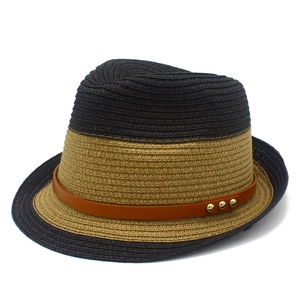 Two-tone straw fedora hat with a brown leather band and gold rivets for sun protection