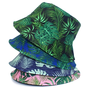 Detailed tropical leaf prints on reversible sun bucket hats in four assorted colors