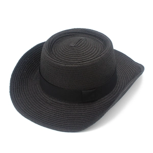 Detailed top view of black woven straw cowboy hat with a wide brim and ribbon