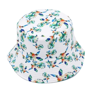 Detailed close-up of white bucket hat with colorful abstract sea turtle prints