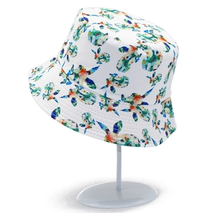 Detail of white bucket hat featuring colorful cartoon rabbit patterns and quilted brim