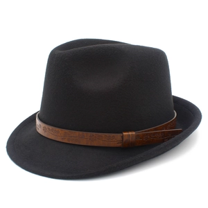 Detailed view of black felt fedora hat featuring an embossed brown leather band decoration