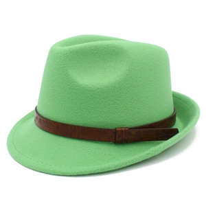 Detail of mint green fedora hat featuring a brown embossed floral faux leather band