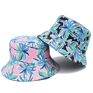 Double-sided bucket hat with tropical palm tree print in pink and navy blue canvas