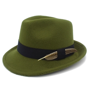 Detailed view of olive green fedora hat with black ribbon and decorative feather accent