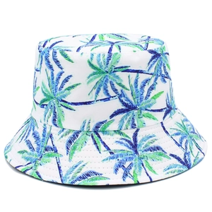 Detail shot of tropical palm tree print on a white canvas bucket hat texture