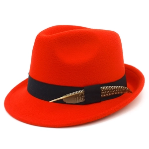 Red wool felt fedora hat with black grosgrain ribbon and spotted feather accent