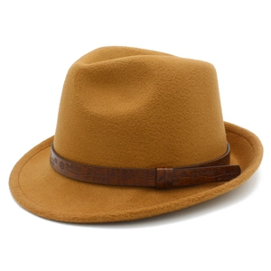 Close-up of camel wool fedora hat featuring embossed brown leather belt trim detail