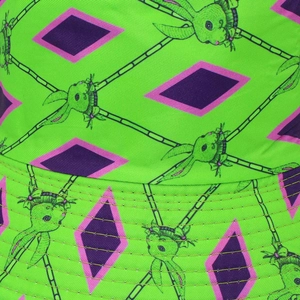 Detail of twill bucket hat with rabbit print and neon green geometric pattern texture