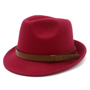 Detail of burgundy fedora hat with brown leather band featuring vintage floral embossing