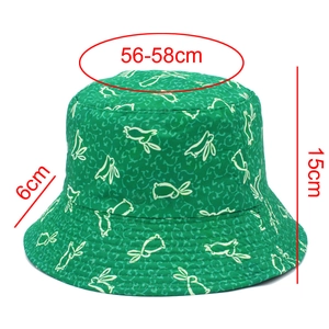 Detail showing dimension marks for green cotton sun hat with cute white rabbit patterns