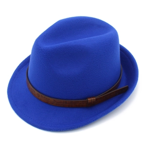 Detail of royal blue fedora hat featuring a brown leather band with floral embossing