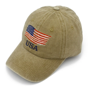 Detail of vintage washed khaki cotton cap with embroidered USA flag and high-quality stitching