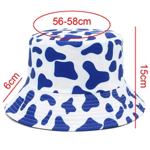 Detail view of cow print bucket hat with dimensions 56-58cm circumference and 6cm brim
