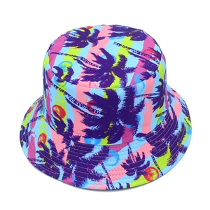 Detail of tropical bucket hat with colorful palm tree prints and summer sunset patterns