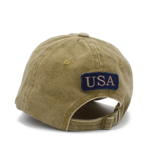 Detail view of the adjustable metal buckle and USA embroidery on khaki cotton baseball cap