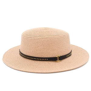 Detail of flat top straw hat featuring a black leather band with metallic studs