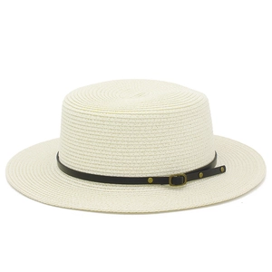 Detailed close-up of woven straw texture with black leather band and golden vintage buckle