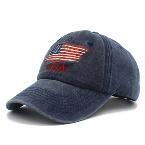 Distressed navy blue cotton baseball cap with embroidered USA flag in a 45-degree angle