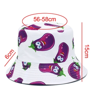 Detailed view of white bucket hat with cartoon eggplant print and size measurements