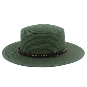 Detail of dark green straw hat with black leather band and gold rivet accents