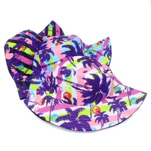 Detailed pattern of tropical coconut tree print on colorful summer bucket hats