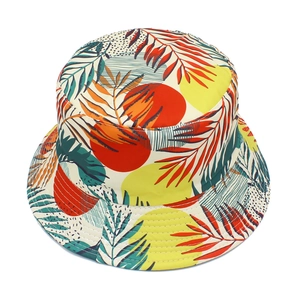 Detail of a tropical print bucket hat featuring palm leaf patterns and durable stitching