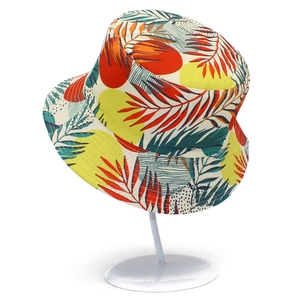 Detailed macro view of tropical palm leaf print on a foldable sun bucket hat
