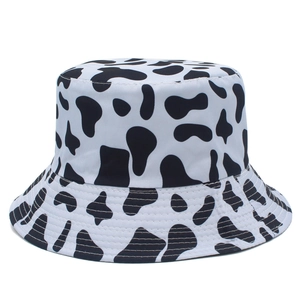 Close-up of black and white cow print bucket hat with high-quality twill fabric texture