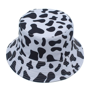 Detailed view of the cow print pattern and parallel stitching on the brim of the bucket hat