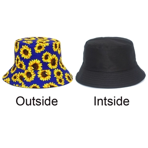 Detailed view showing the reversible design with sunflower pattern and solid black side