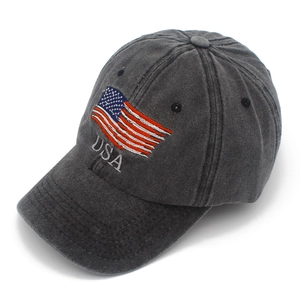 Close-up of embroidered USA flag on washed dark grey cotton baseball sun hat