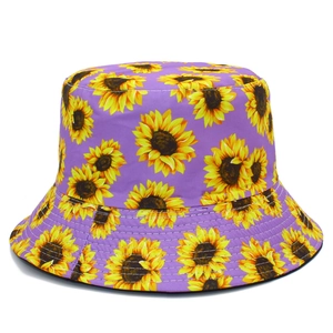 Detail view of purple sunflower bucket hat with yellow floral print and stitched brim